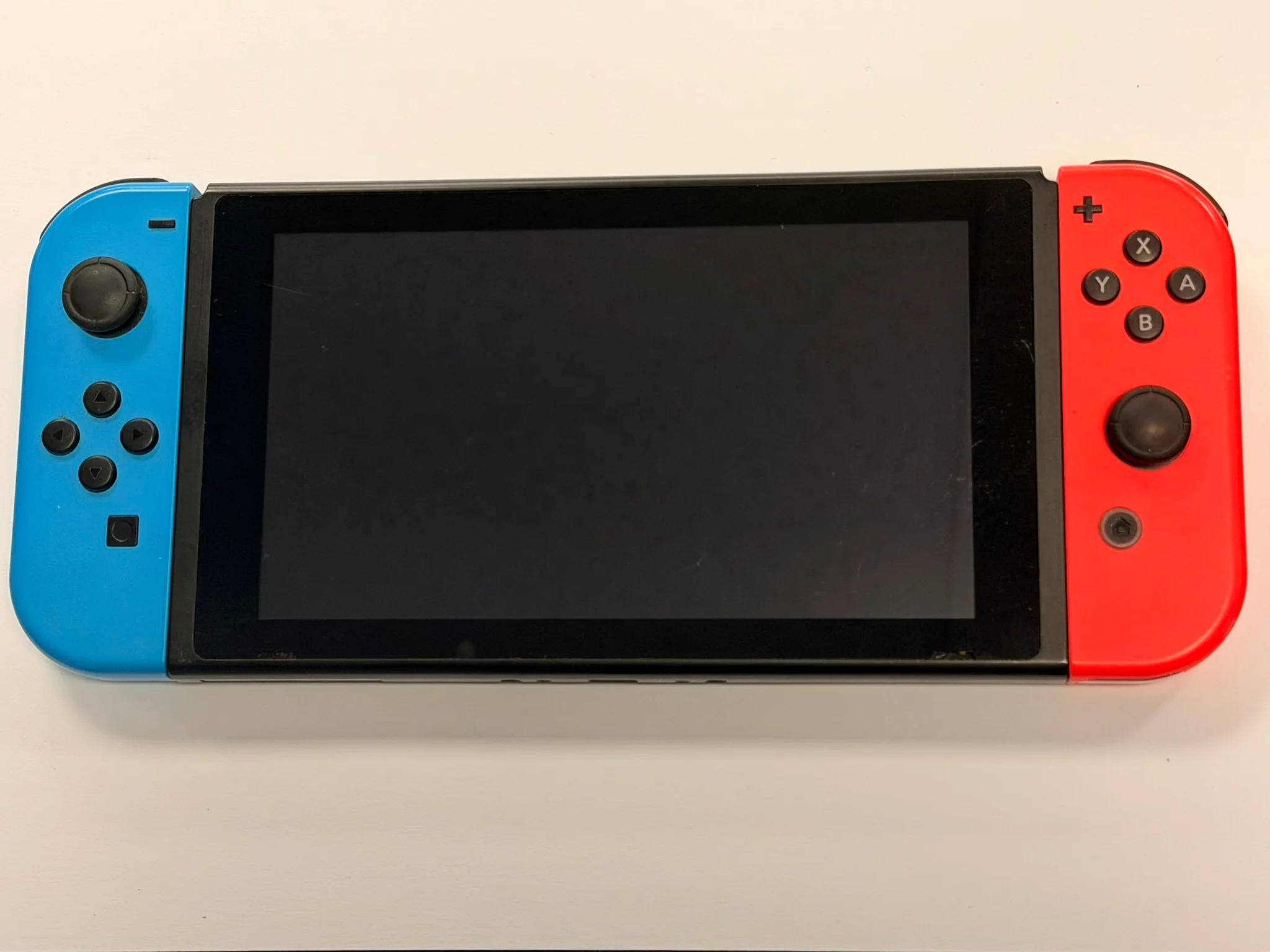 nintendo switch console red and blue joycons no dock - Image 3
